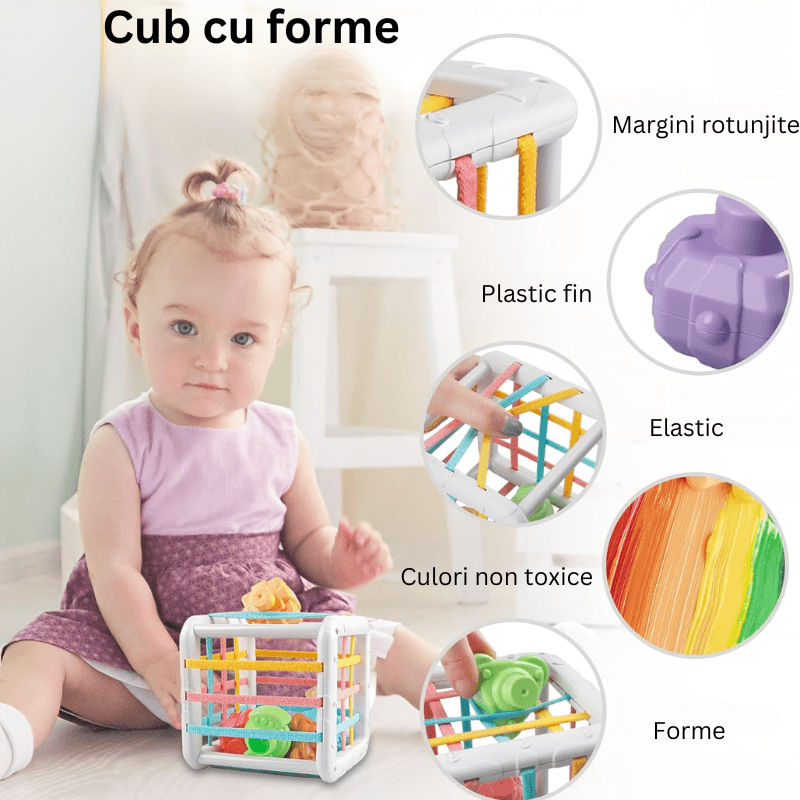 Bebeluș explorând formele și benzile elastice ale sortatorului
