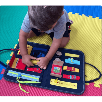 Resigilat - Carte Senzoriala Interactiva Montessori, Jucarie de Calatorie, 25 Activitati, Motricitate Fina, Creativitate si Indemanare, 28 x 23 Cm, +1 An - LUDIRO