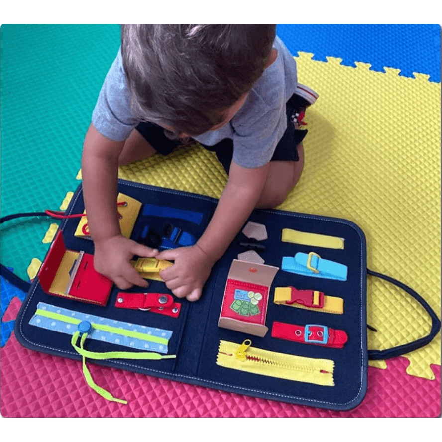 Resigilat - Carte Senzoriala Interactiva Montessori, Jucarie de Calatorie, 25 Activitati, Motricitate Fina, Creativitate si Indemanare, 28 x 23 Cm, +1 An - LUDIRO