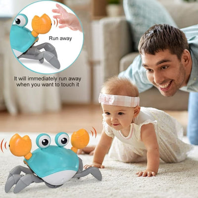 Resigilat - Jucarie Interactiva Bebelusi, Crab Care se Taraste, Muzica, Senzor de Obstacole, Stimuleaza Miscarea, Acumulator cu Incarcare USB, Albastru, 23x14x11 Cm, + 9 Luni - LUDIRO